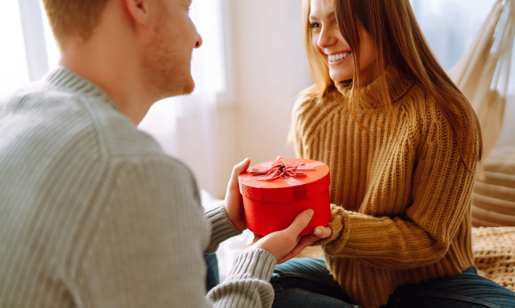 Couple exchanging anniversary gift