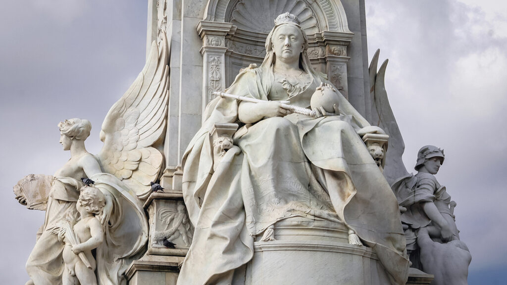 Statue of an enthroned Queen Victoria, part of Victoria Memorial in front of Buckingham Palace in London city, UK